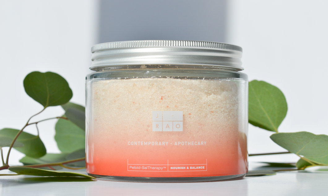 Close up image of Nourish and Balance bathing salts in jar. 500g 